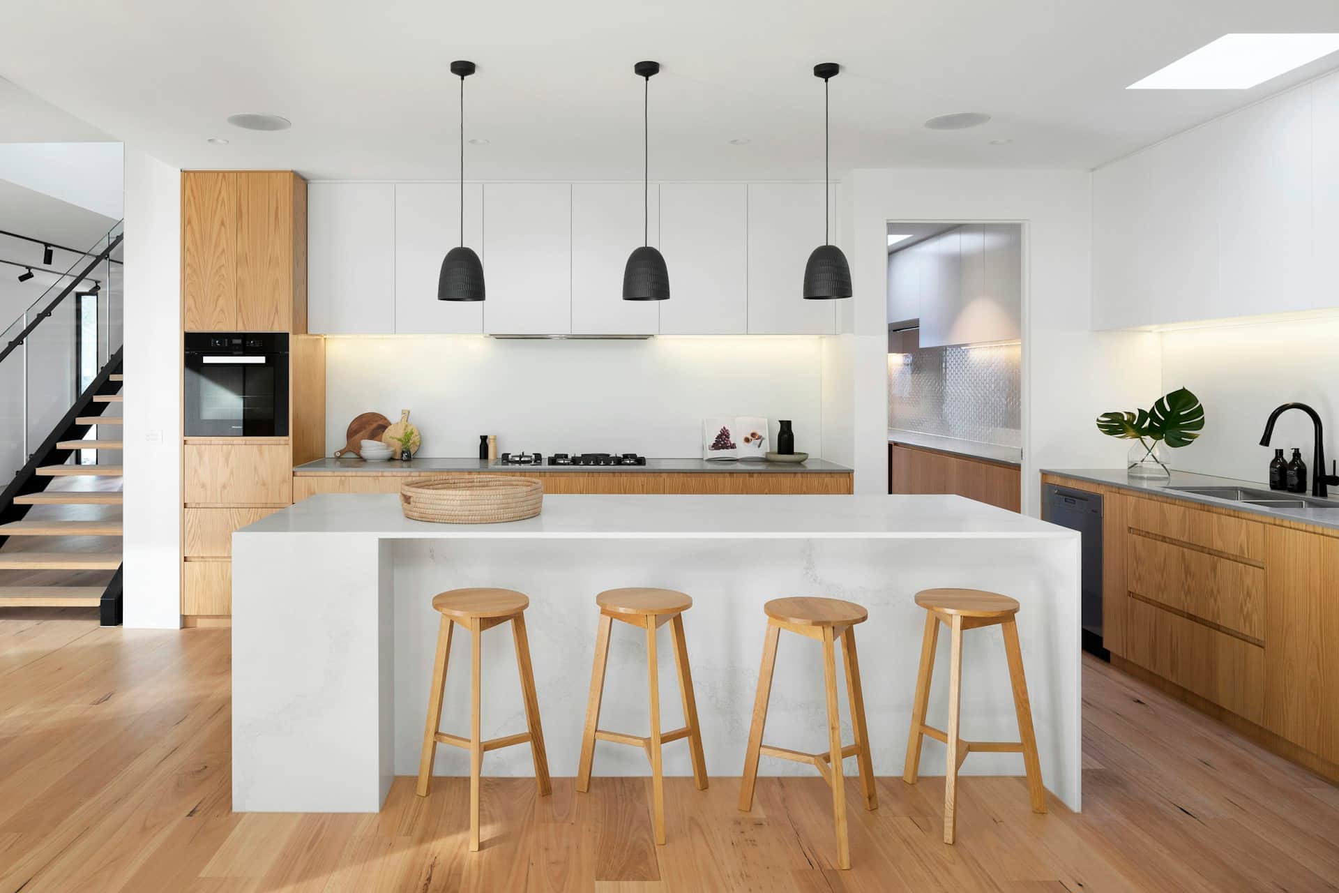 White and oak kitchen inside a side return extension designed from side extension drawings in London