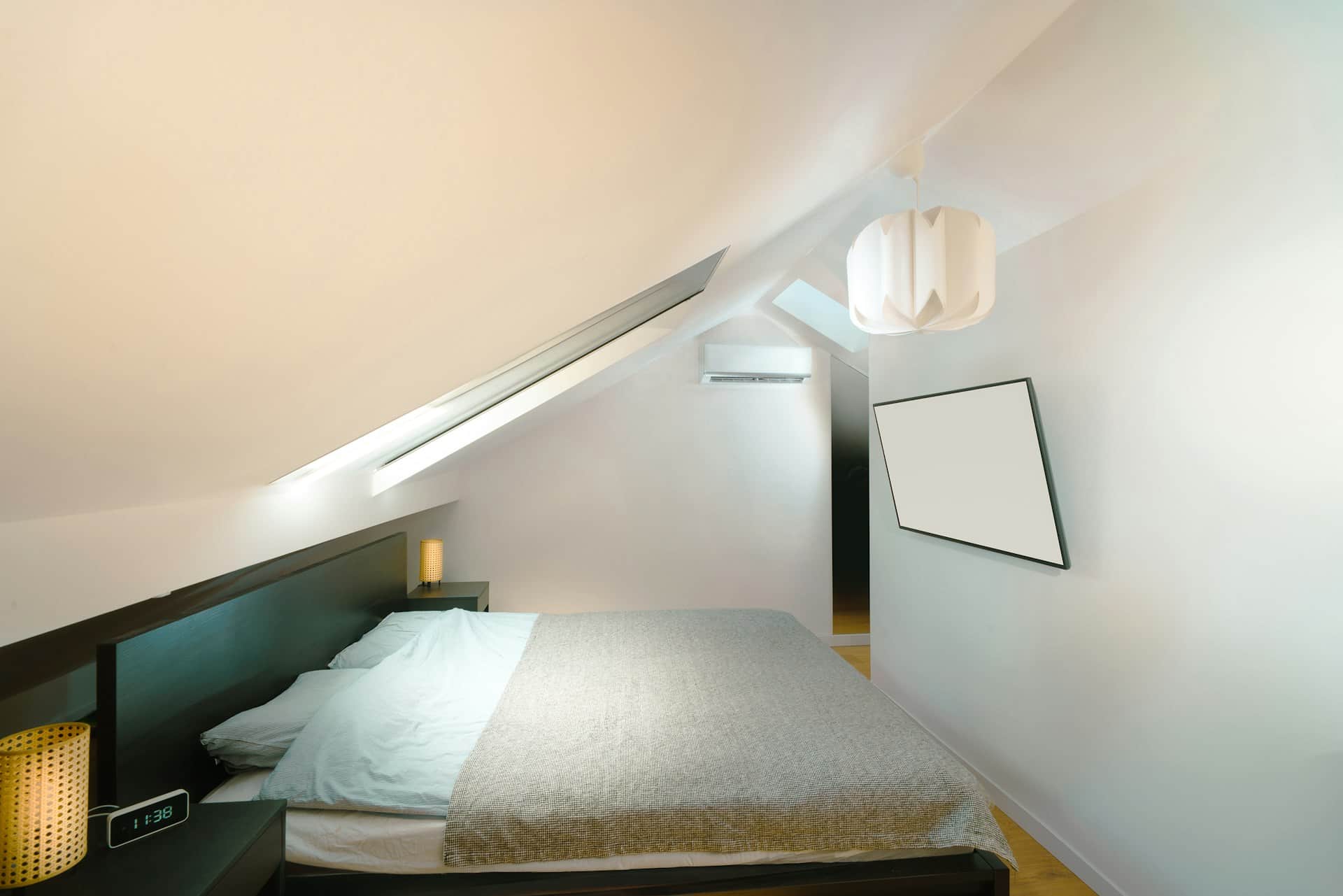 Loft conversion bedroom with skylights designed from loft conversion plans in London