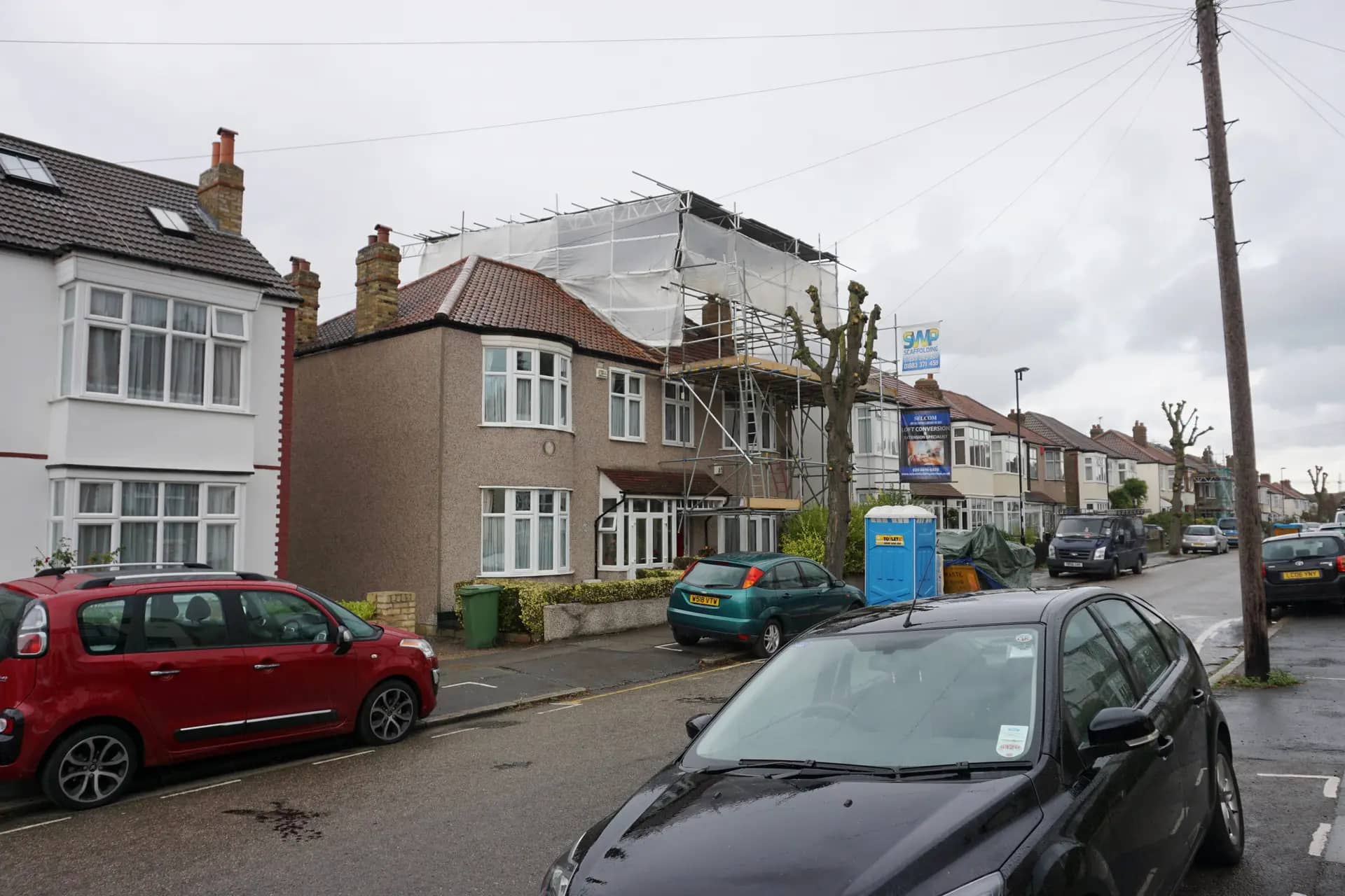 Terraced house in Lewisham with a loft dormer, where a new top floor needs a protected escape route down the stairs