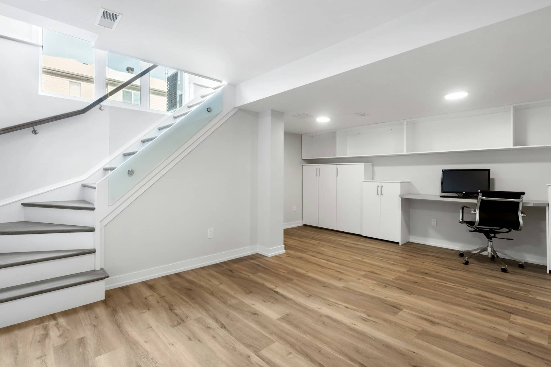 Basement conversion plans London — converted basement living space with natural light in a London home
