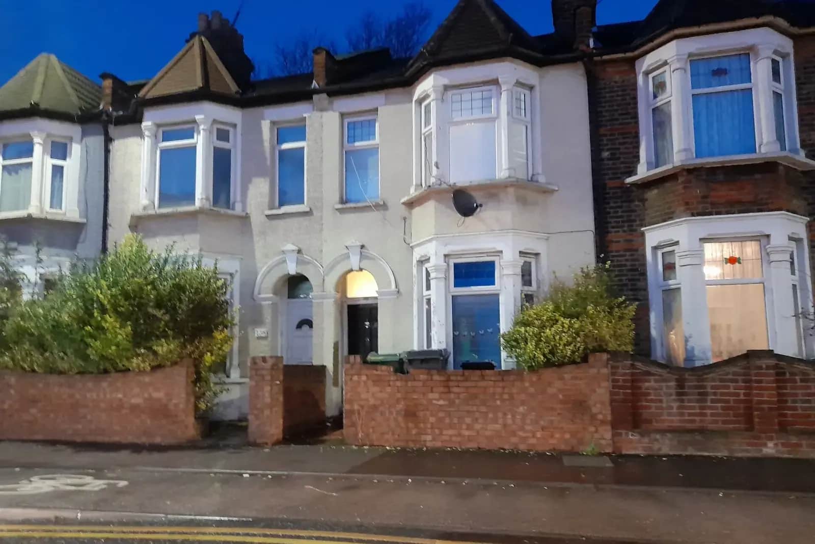 Terraced houses on Blackhorse Road in Walthamstow with white rendered fronts, two-storey bay windows and low brick front walls