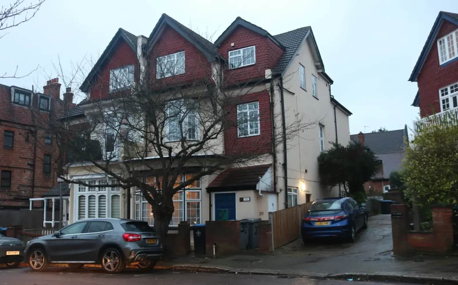 Large Edwardian house on Heathfield Park in Willesden with three tiled gables and a loft extension, a grey car on the drive