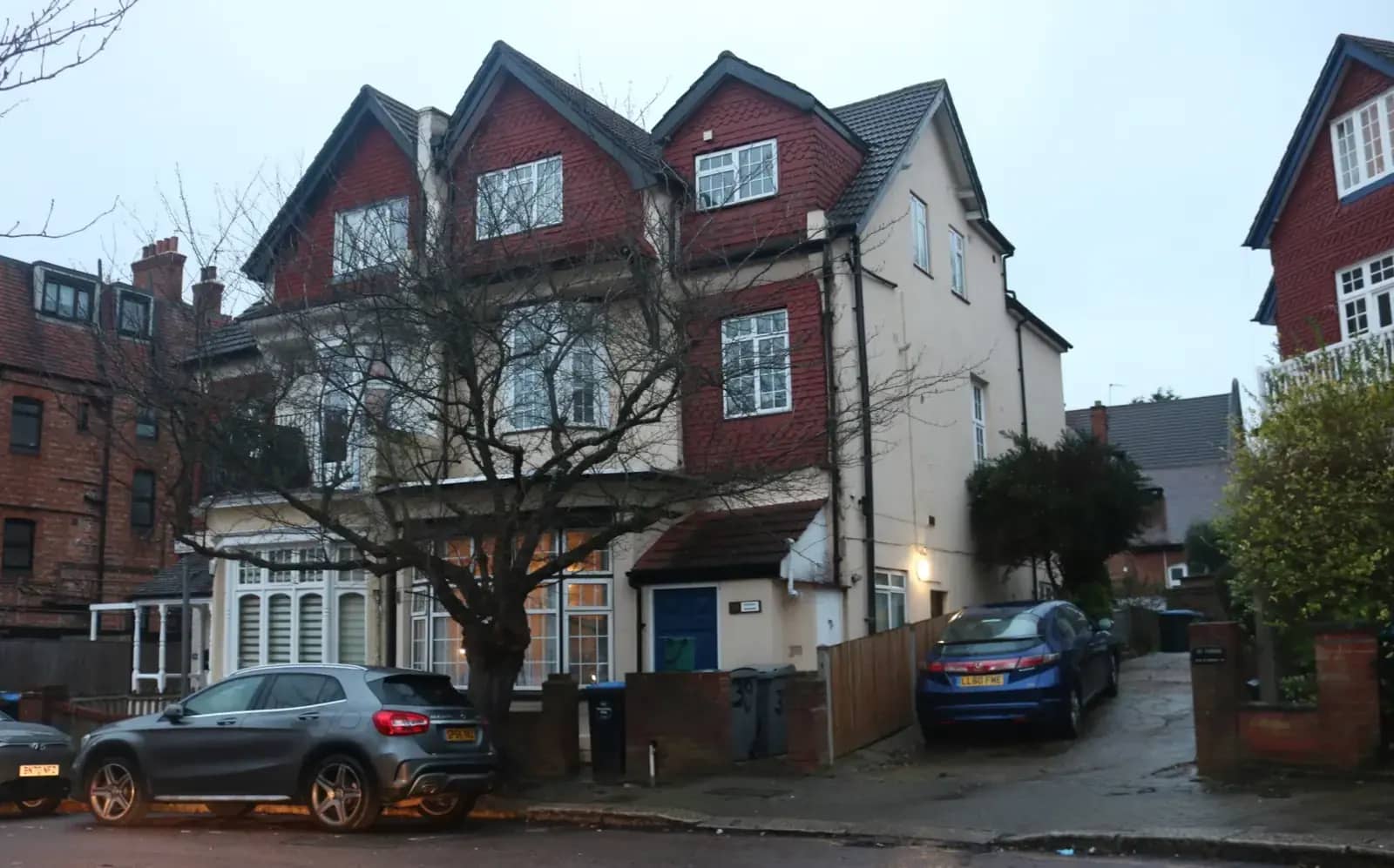 Large Edwardian house on Heathfield Park in Willesden with three tiled gables and a loft extension, a grey car on the drive