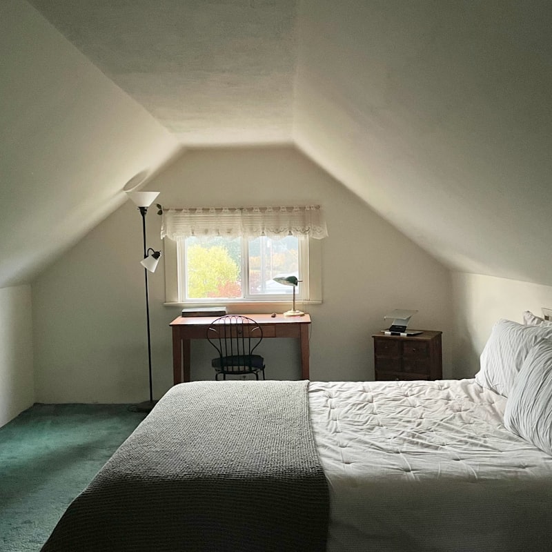 Attic bedroom in a London loft conversion with dormer window